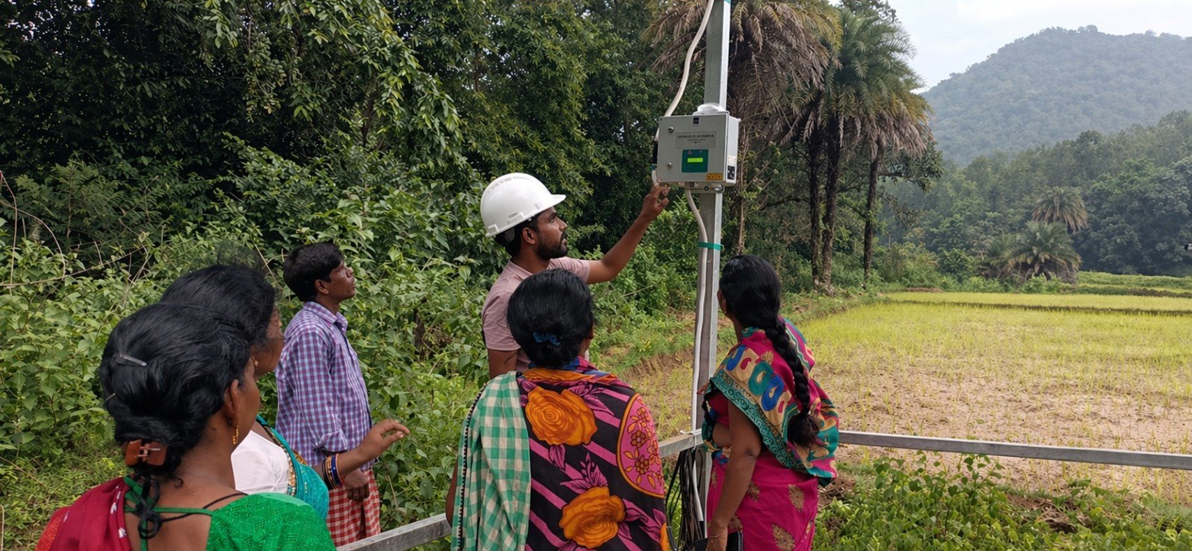 An SPIF technician showing a community group how to operate the control panel