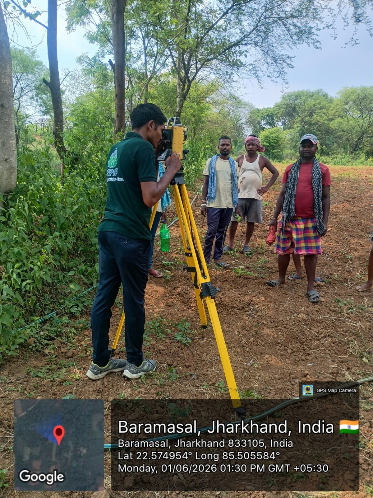 Precision survey equipment set up in a field for site assessment
